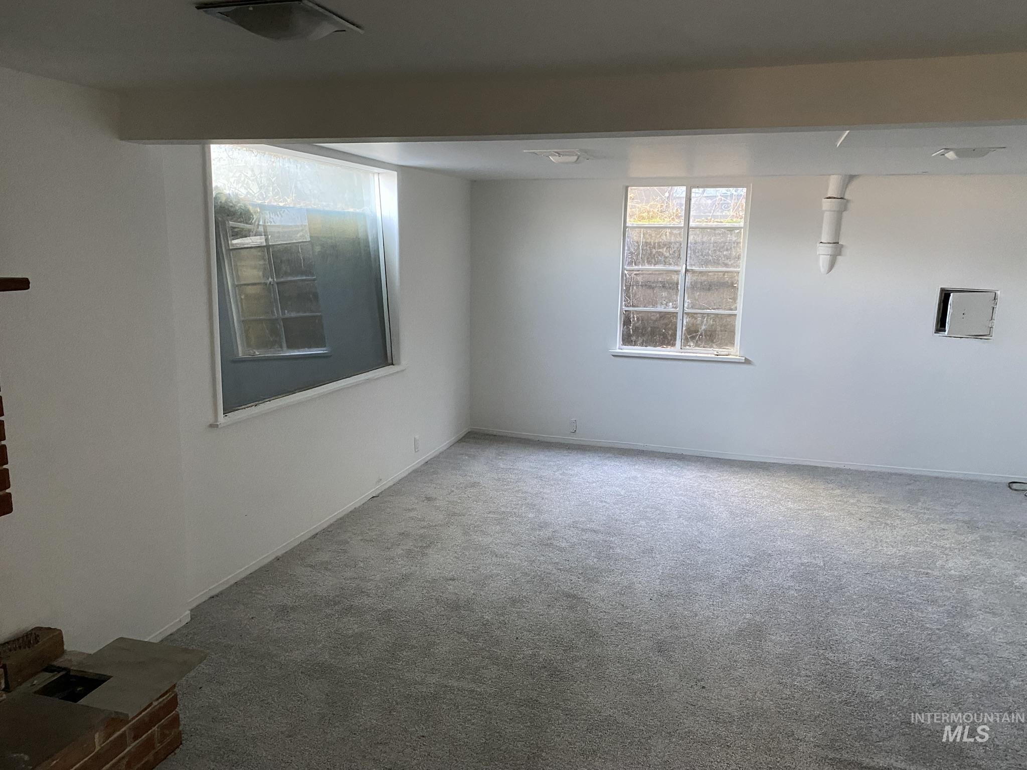 Below grade area with carpet floors and baseboards