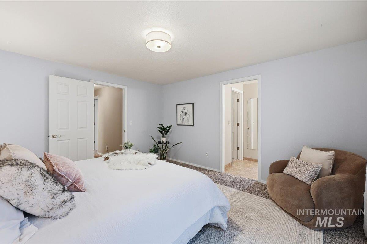 Carpeted bedroom with baseboards