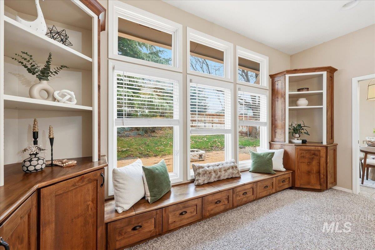 Living area featuring light colored carpet