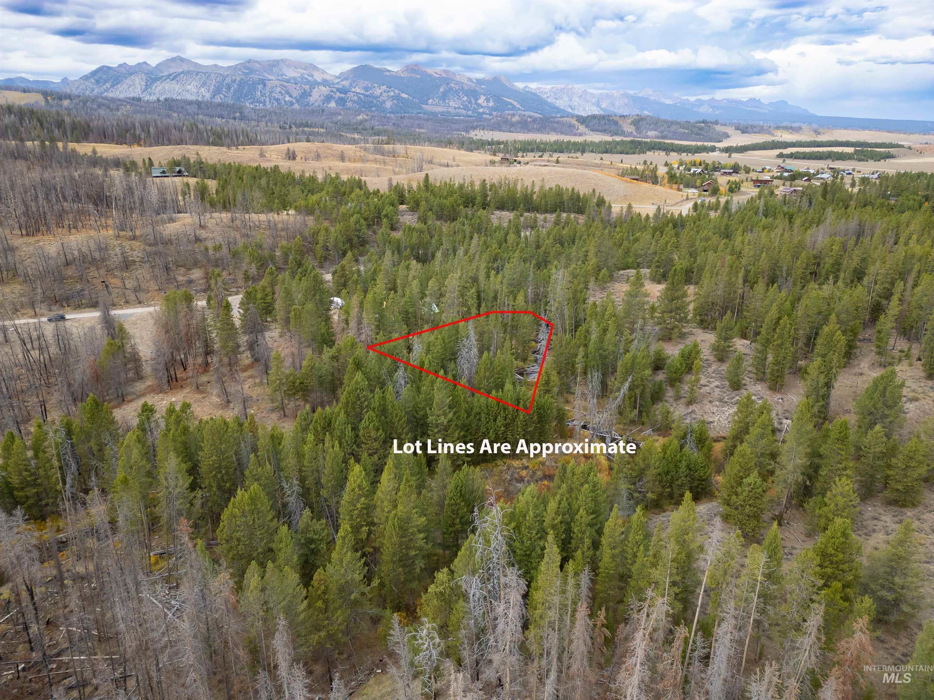 View of property location with a mountain backdrop and property parcel outlined