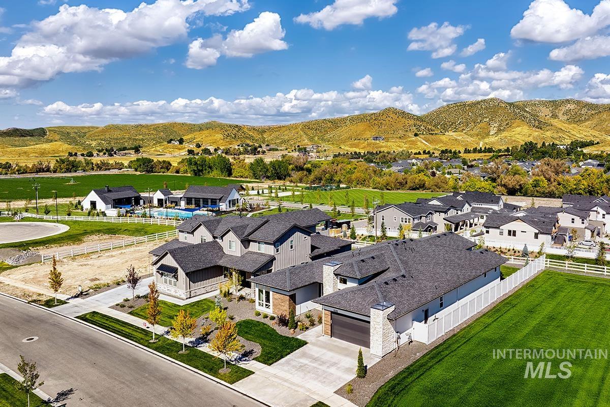 Aerial perspective of suburban area featuring a mountain backdrop