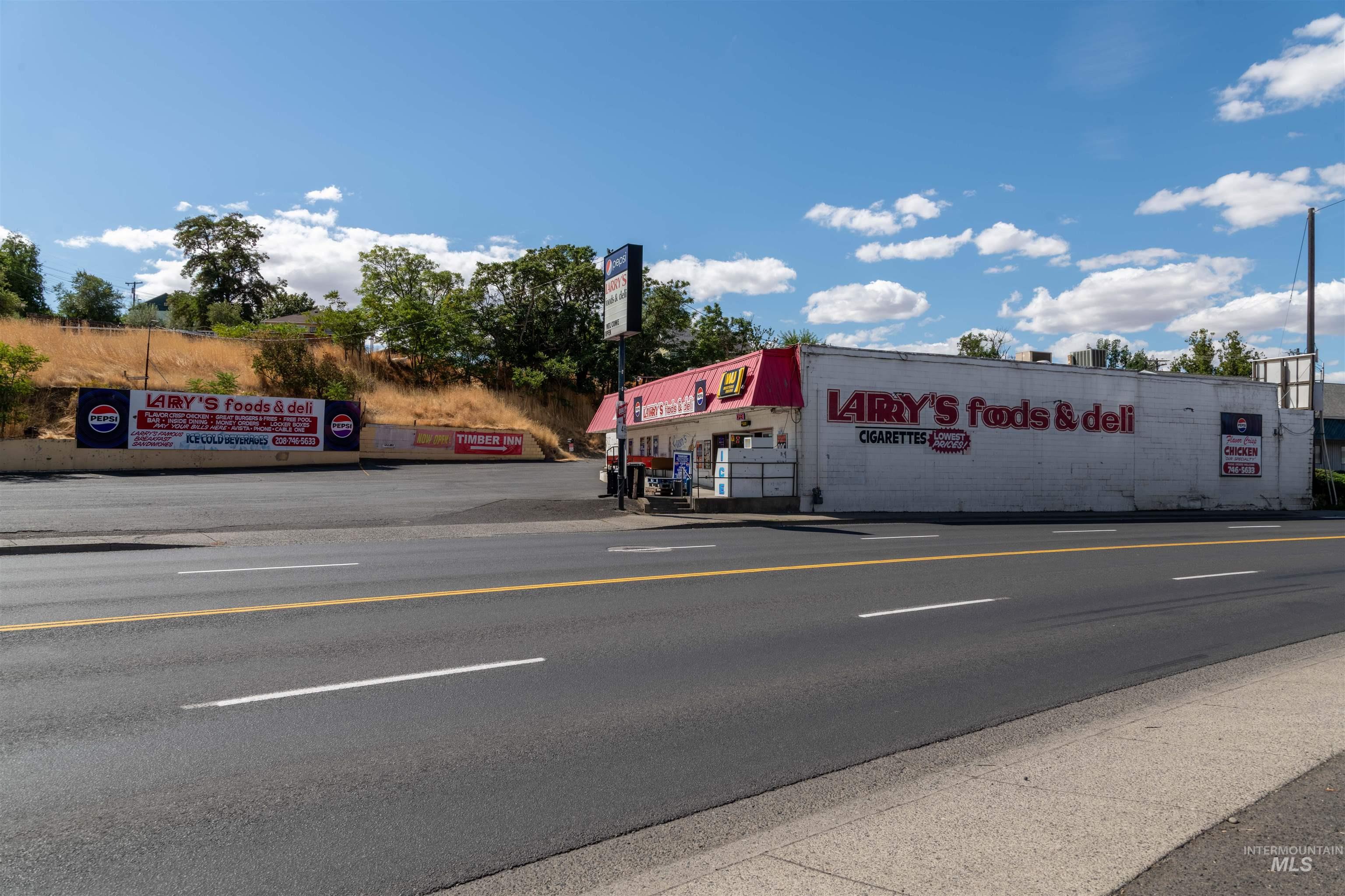 View of asphalt street with curbs