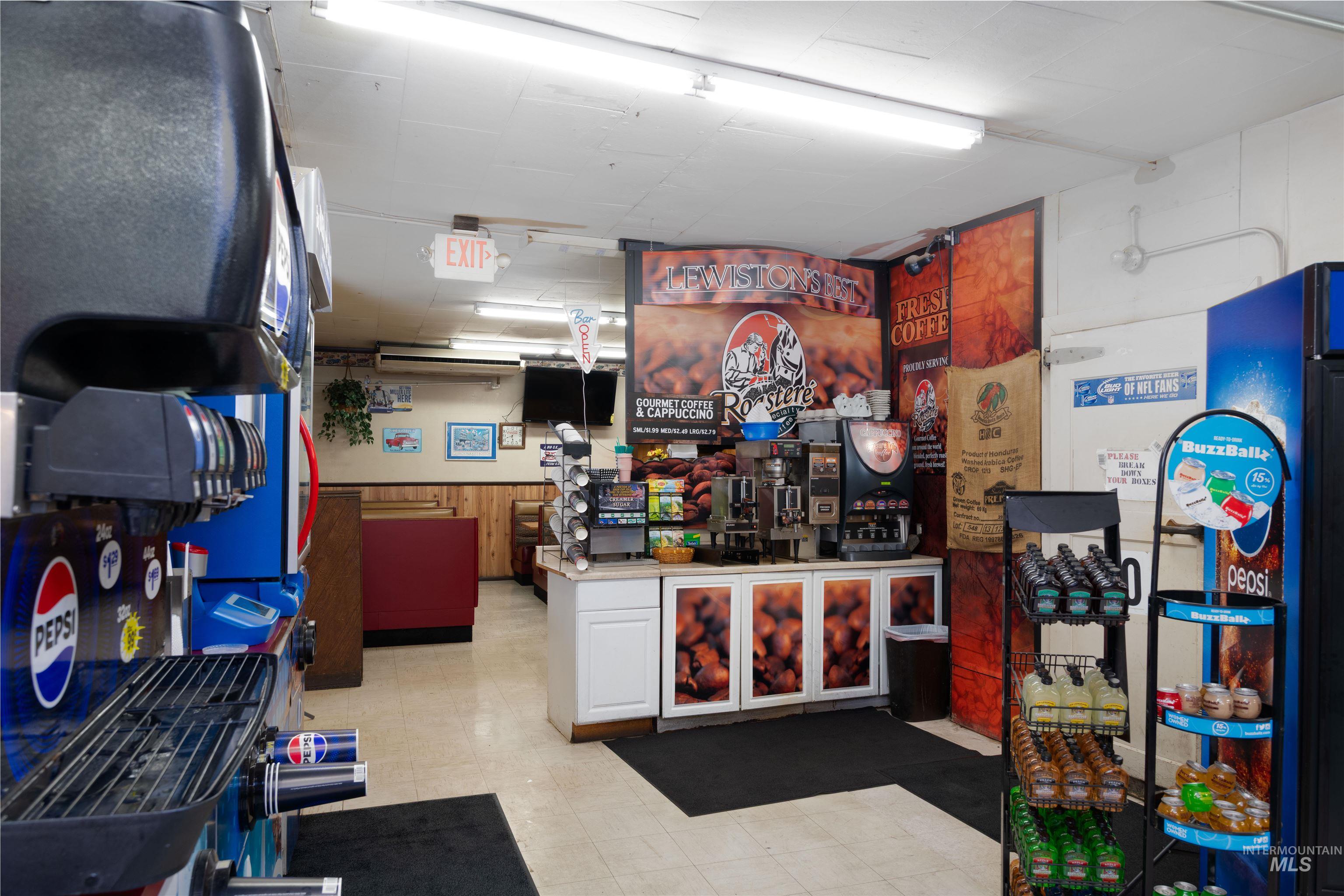 Miscellaneous room featuring a wainscoted wall and wood walls