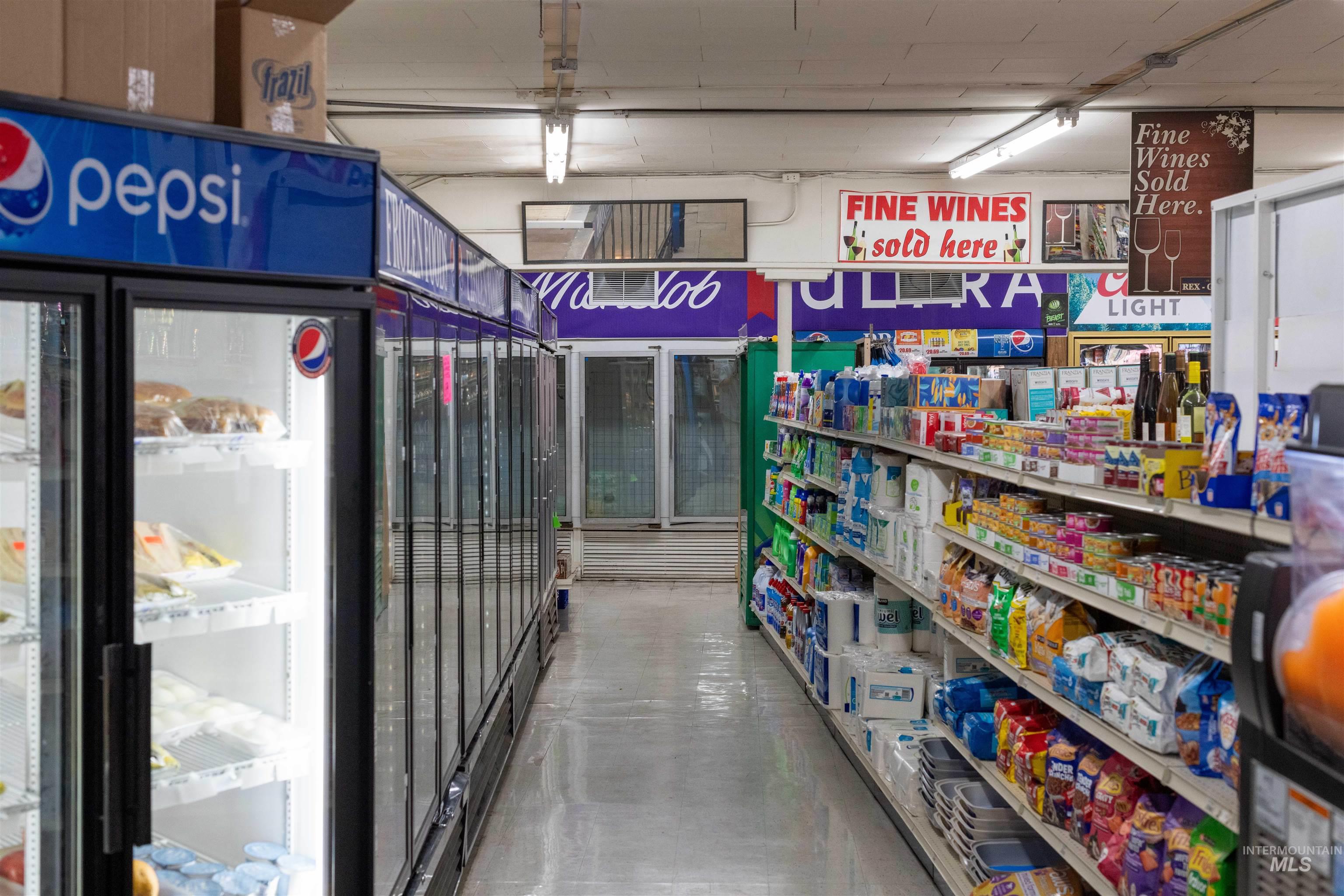 Miscellaneous room featuring finished concrete flooring