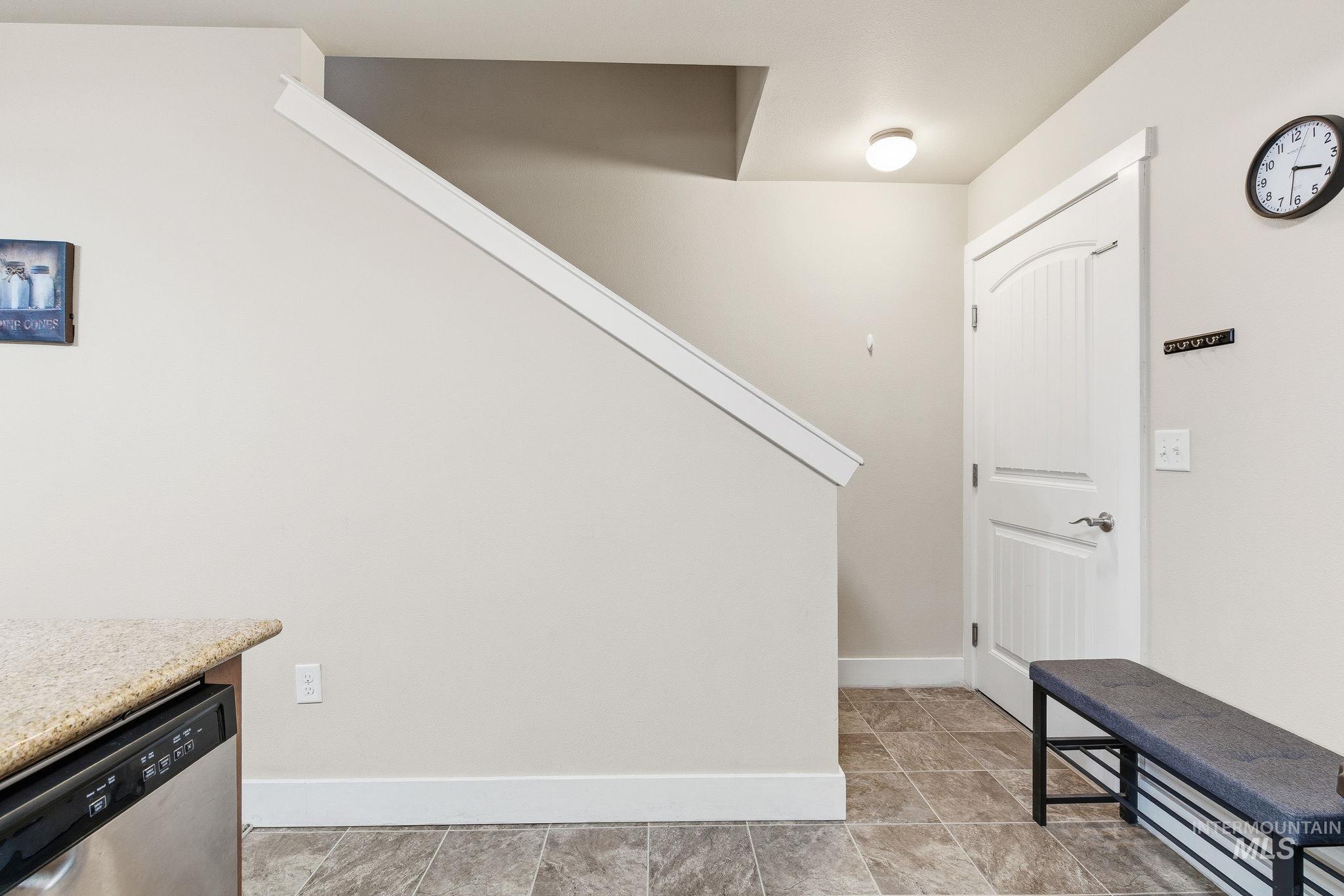 Staircase featuring baseboards