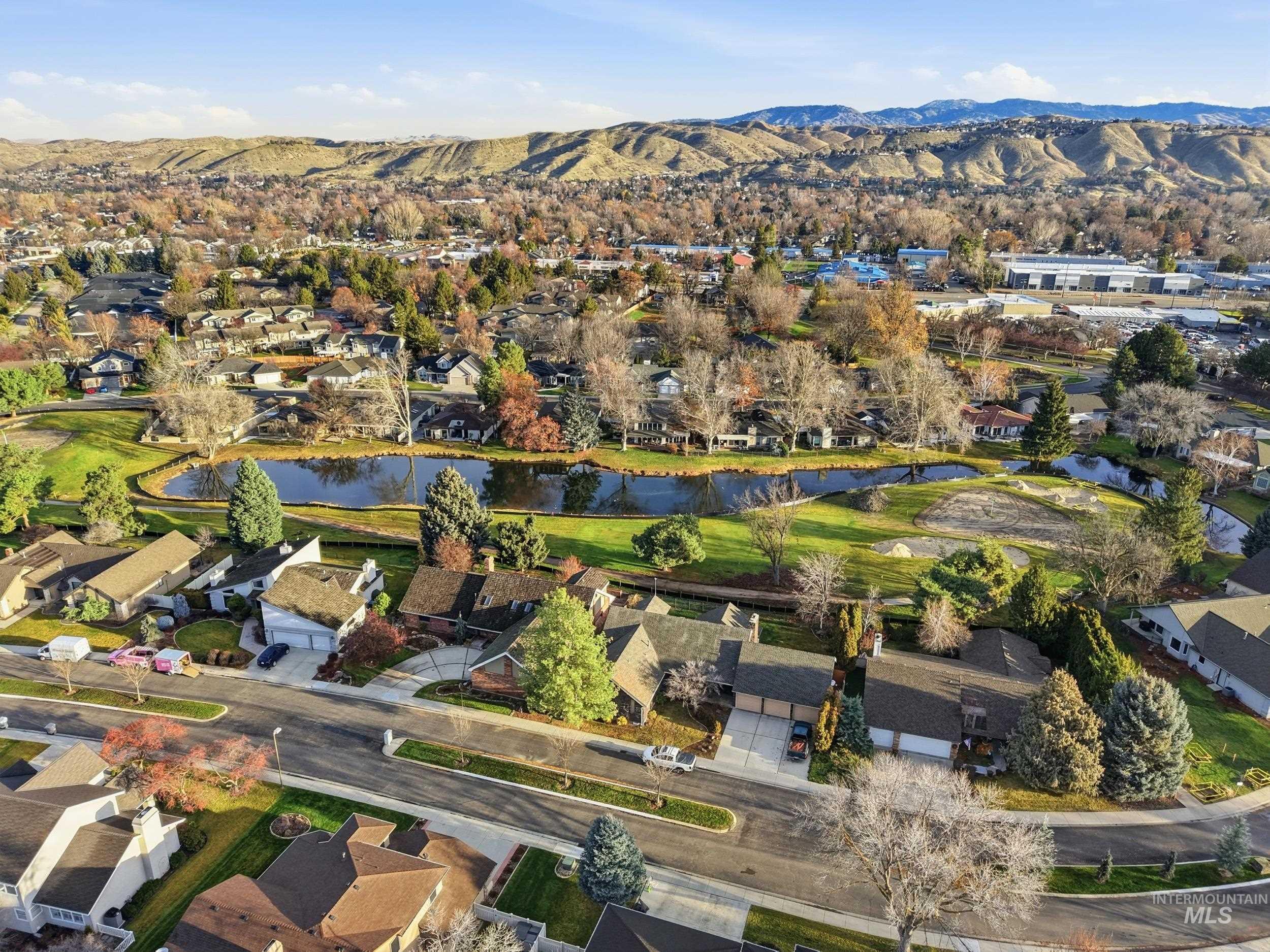 View of property location with nearby suburban area and a water and mountain view