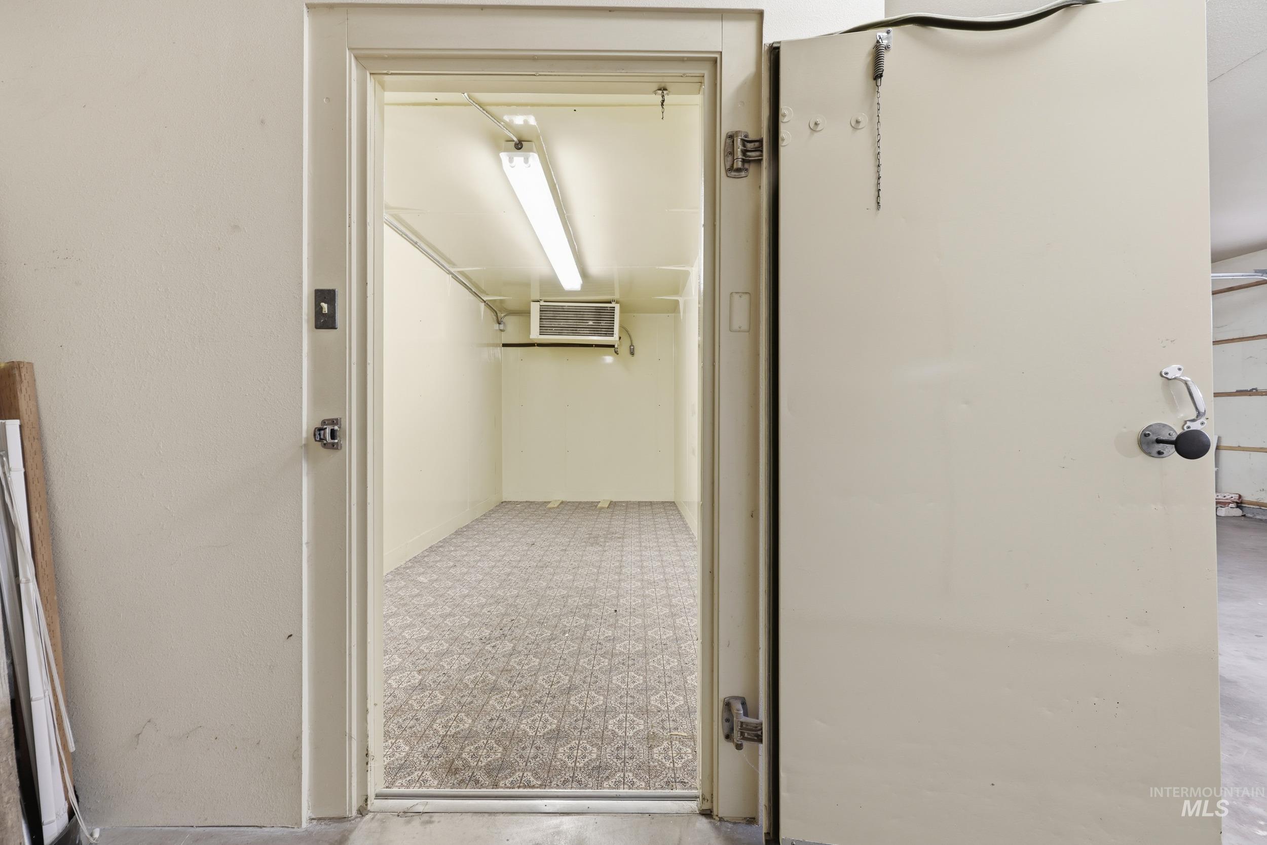 Hall with tile patterned floors