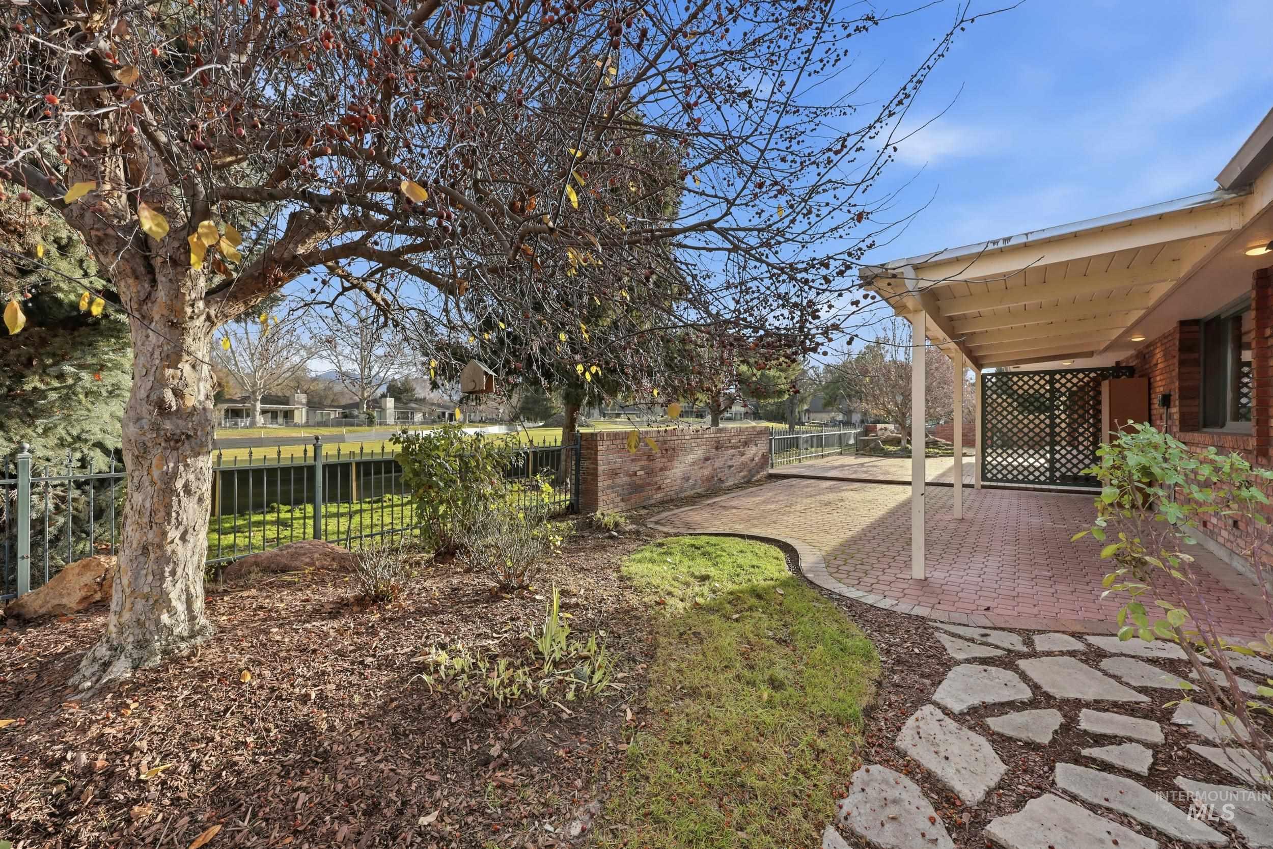 Fenced backyard featuring a patio
