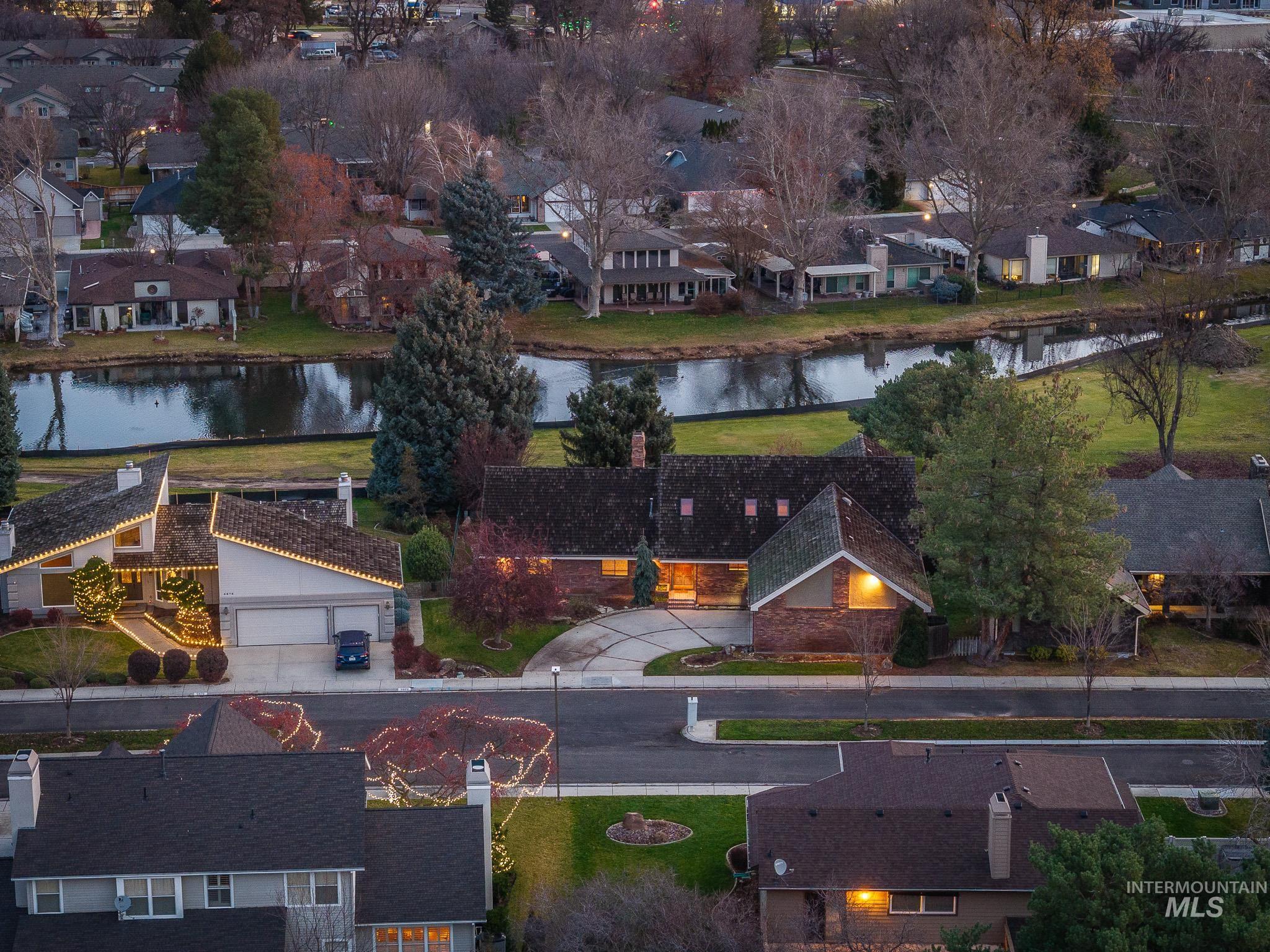 Aerial perspective of suburban area with a large body of water