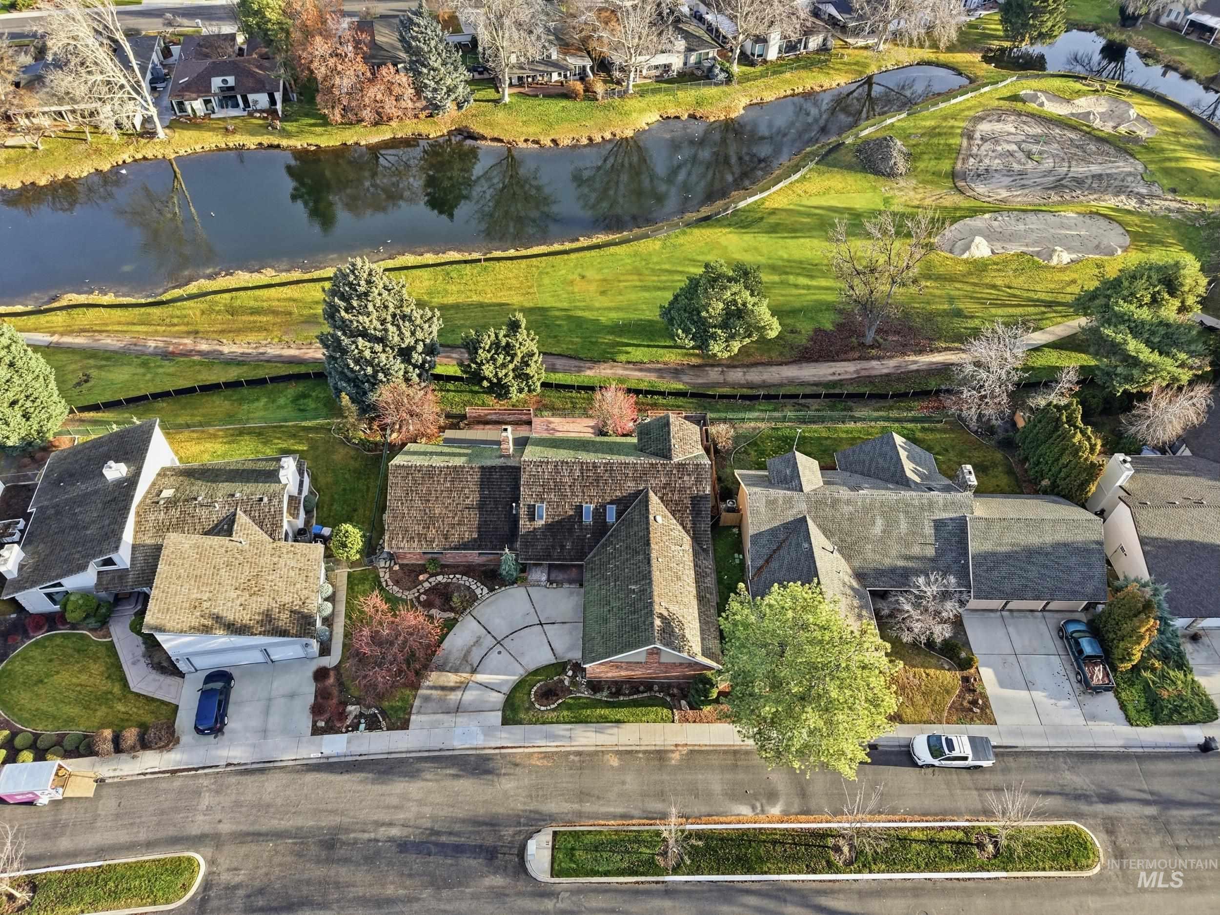 View of property location with nearby suburban area and a nearby body of water