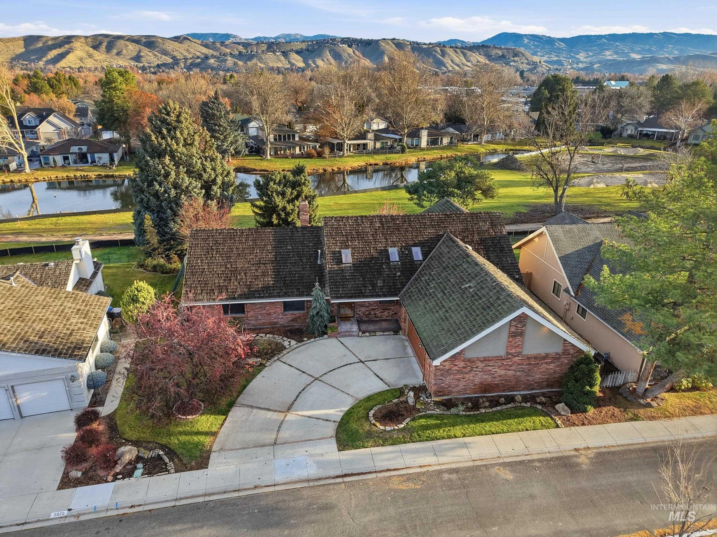 Aerial view of residential area with a water and mountain view