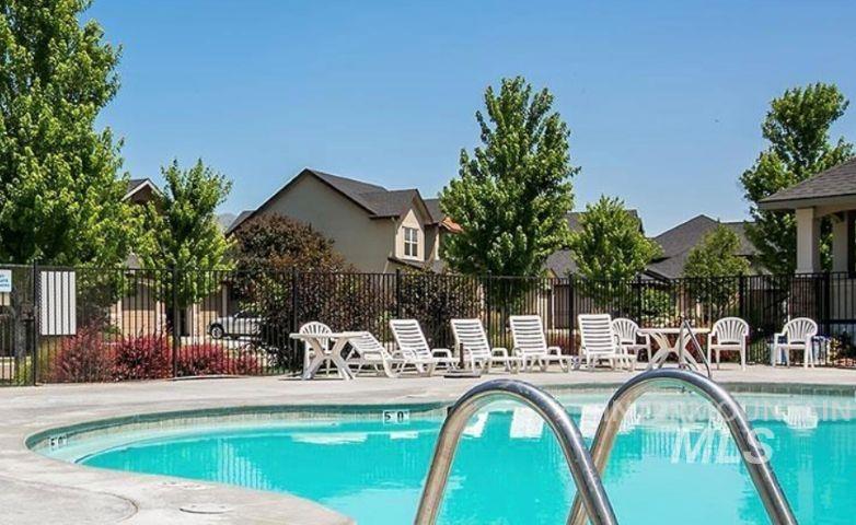 Community pool featuring a patio