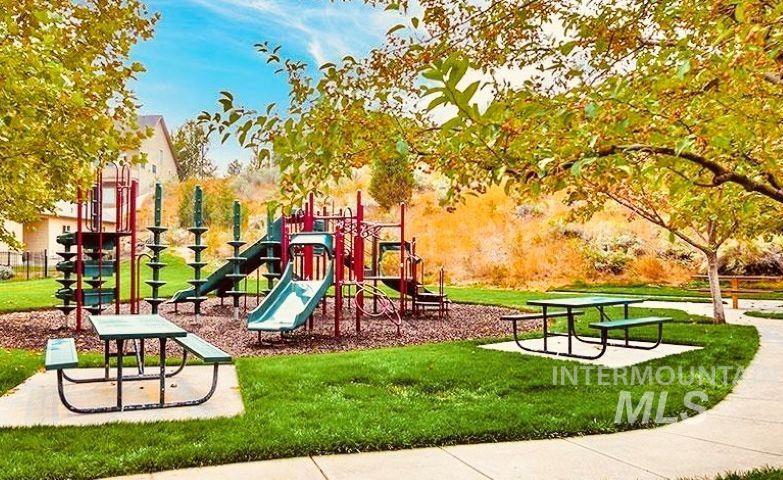 Community playground featuring a lawn