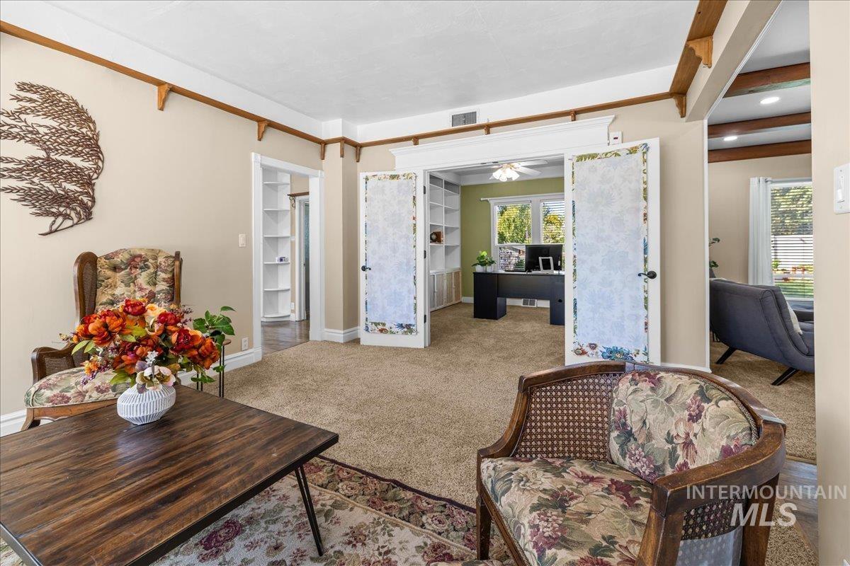 Carpeted living area facing the office.