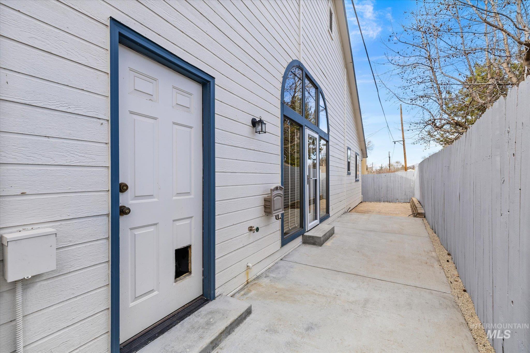 Entrance to property featuring a patio