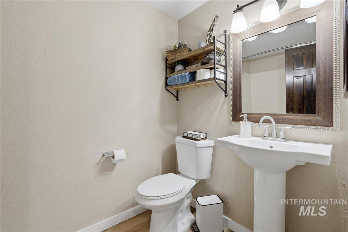Bathroom with baseboards and wood finished floors