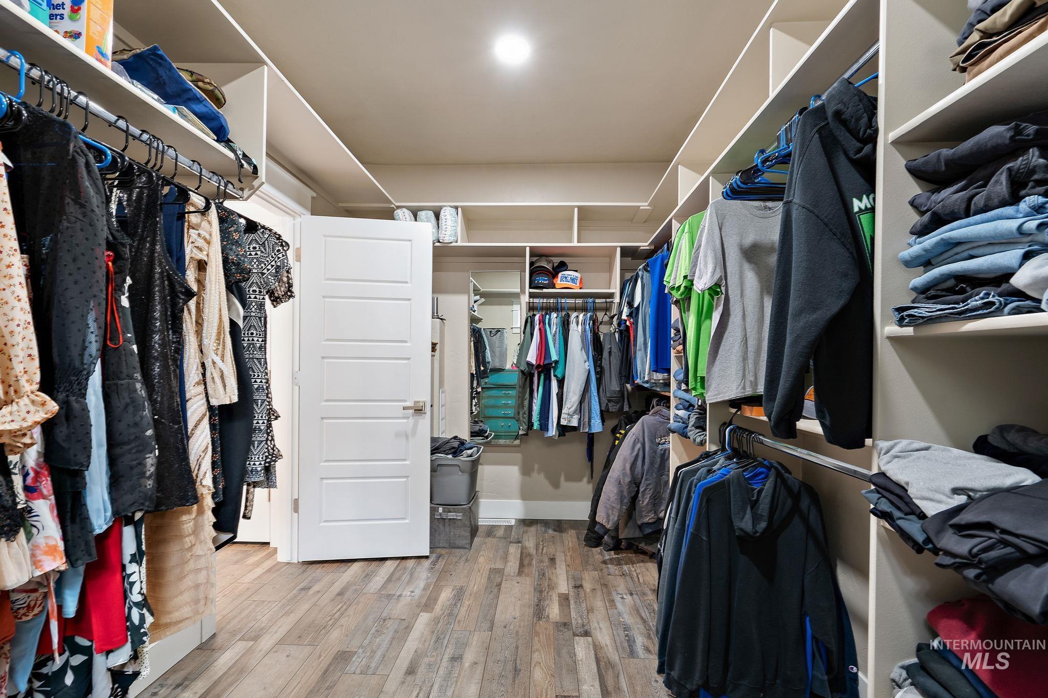 Walk in closet featuring light wood finished floors