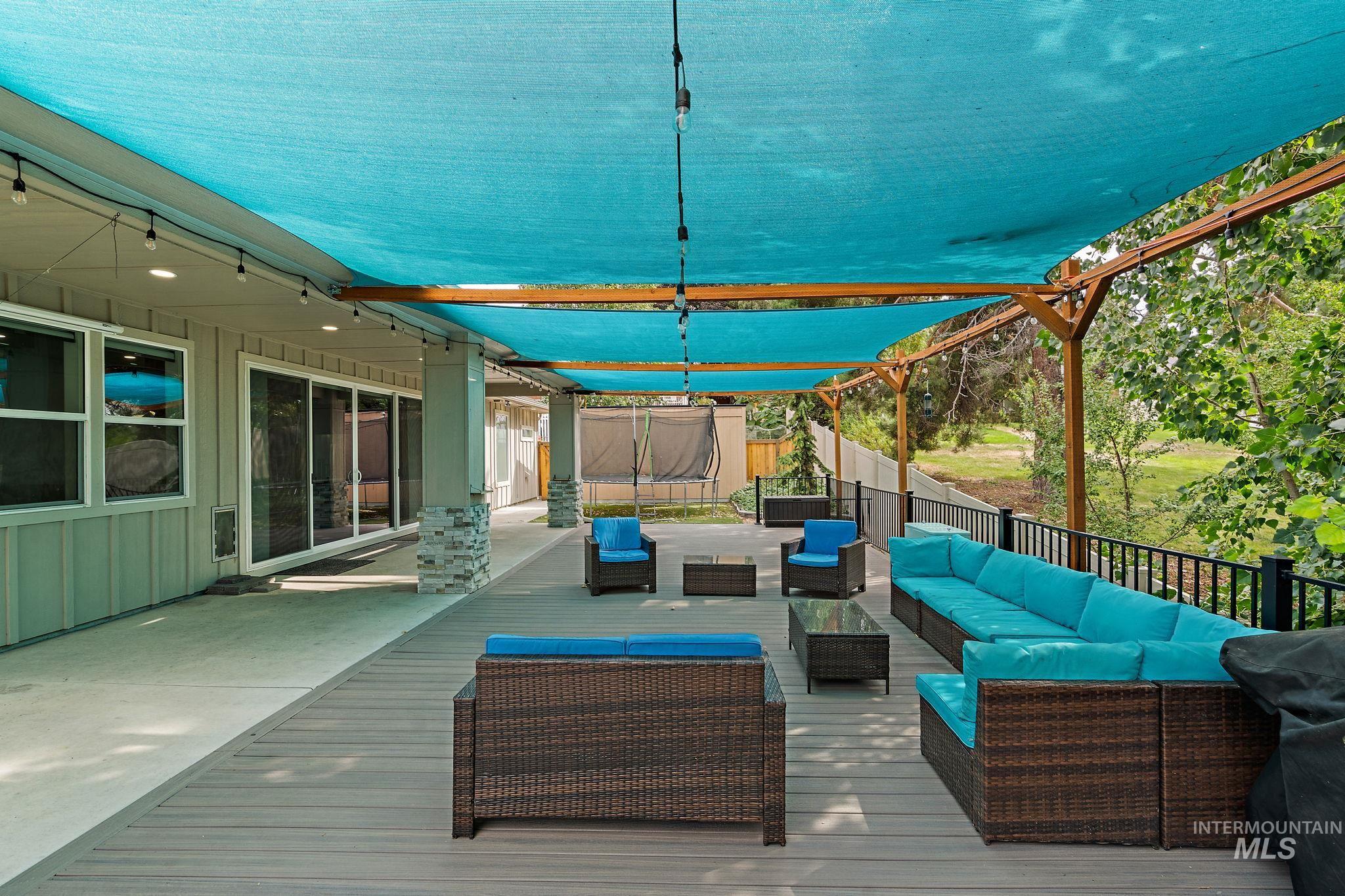 Wooden terrace with an outdoor hangout area