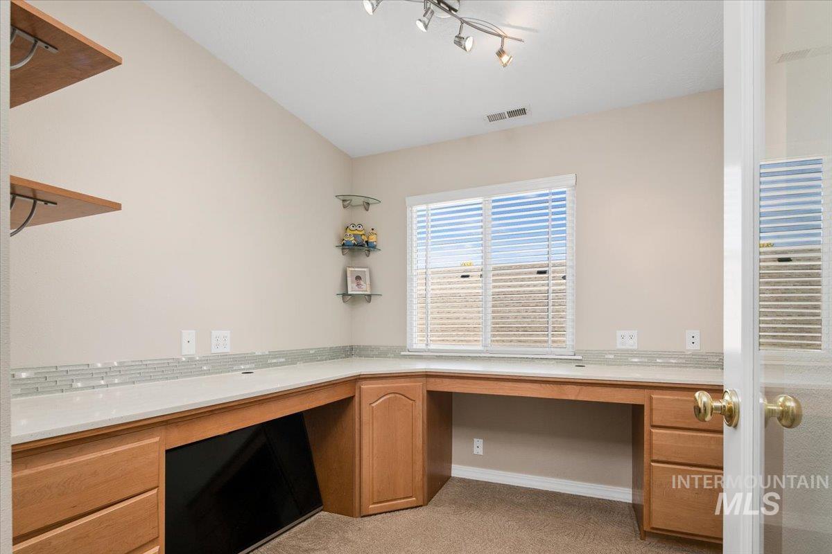 Unfurnished office featuring light carpet