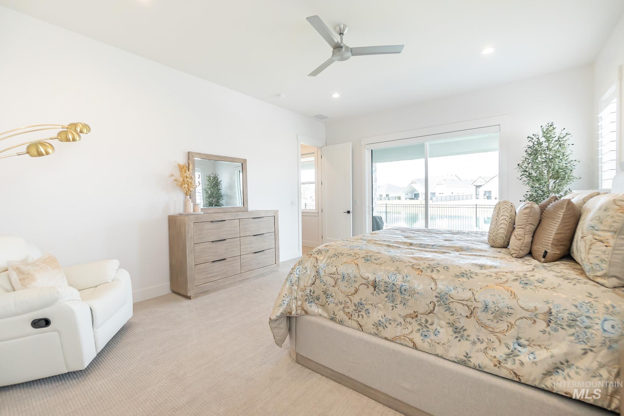 Bedroom featuring access to outside, light colored carpet, recessed lighting, and ceiling fan