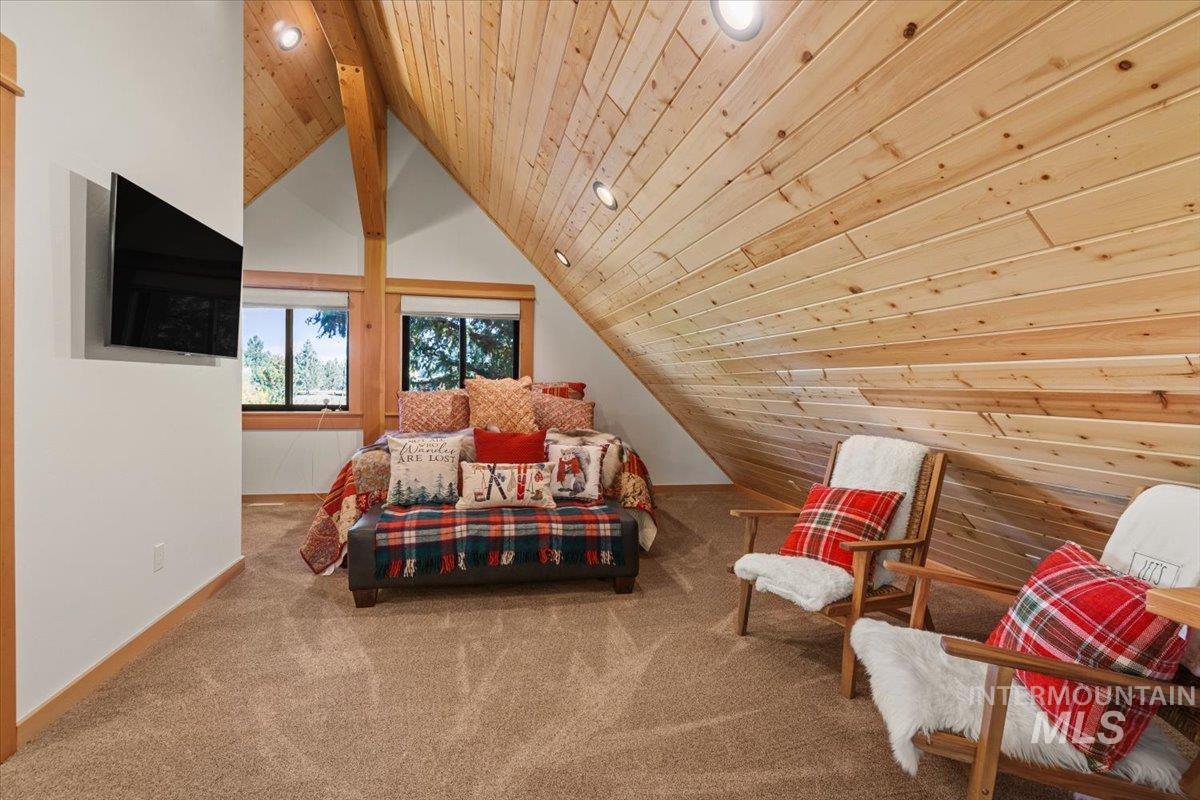 Bedroom featuring wood ceiling, carpet floors, and recessed lighting