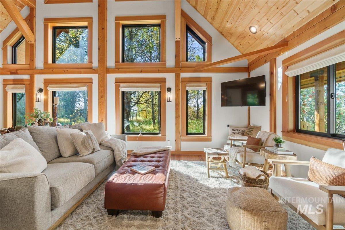 Sunroom featuring lofted ceiling