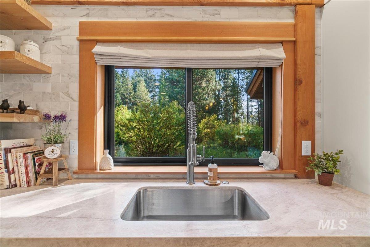 Kitchen view of light stone countertops