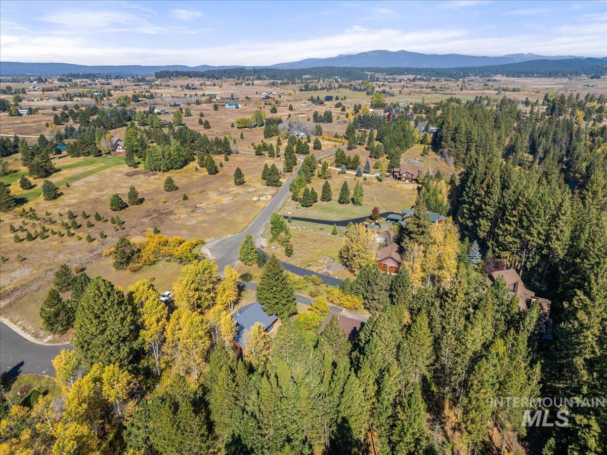 Aerial overview of property's location with a mountain backdrop