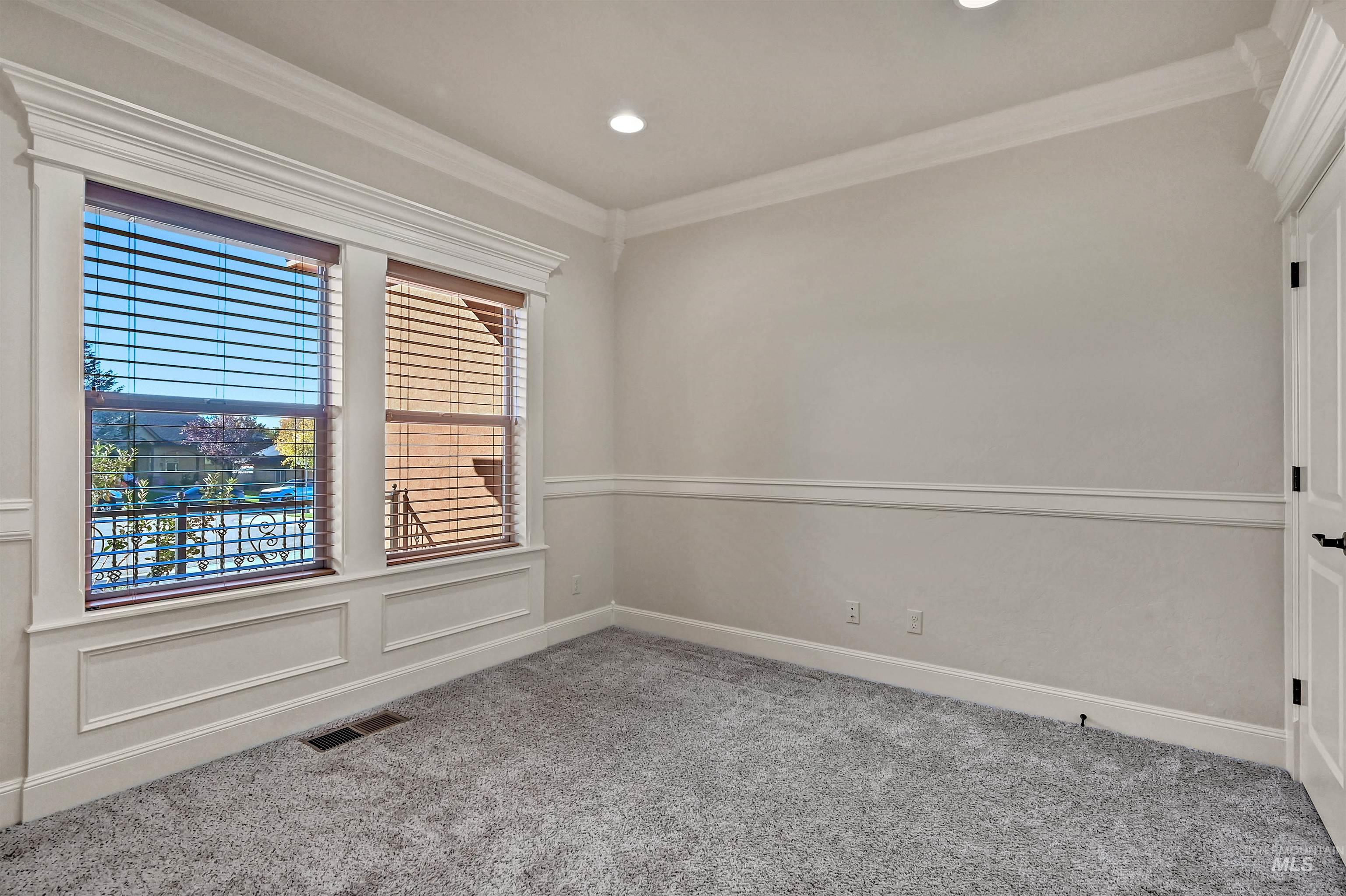 Unfurnished room featuring ornamental molding, light carpet, and recessed lighting
