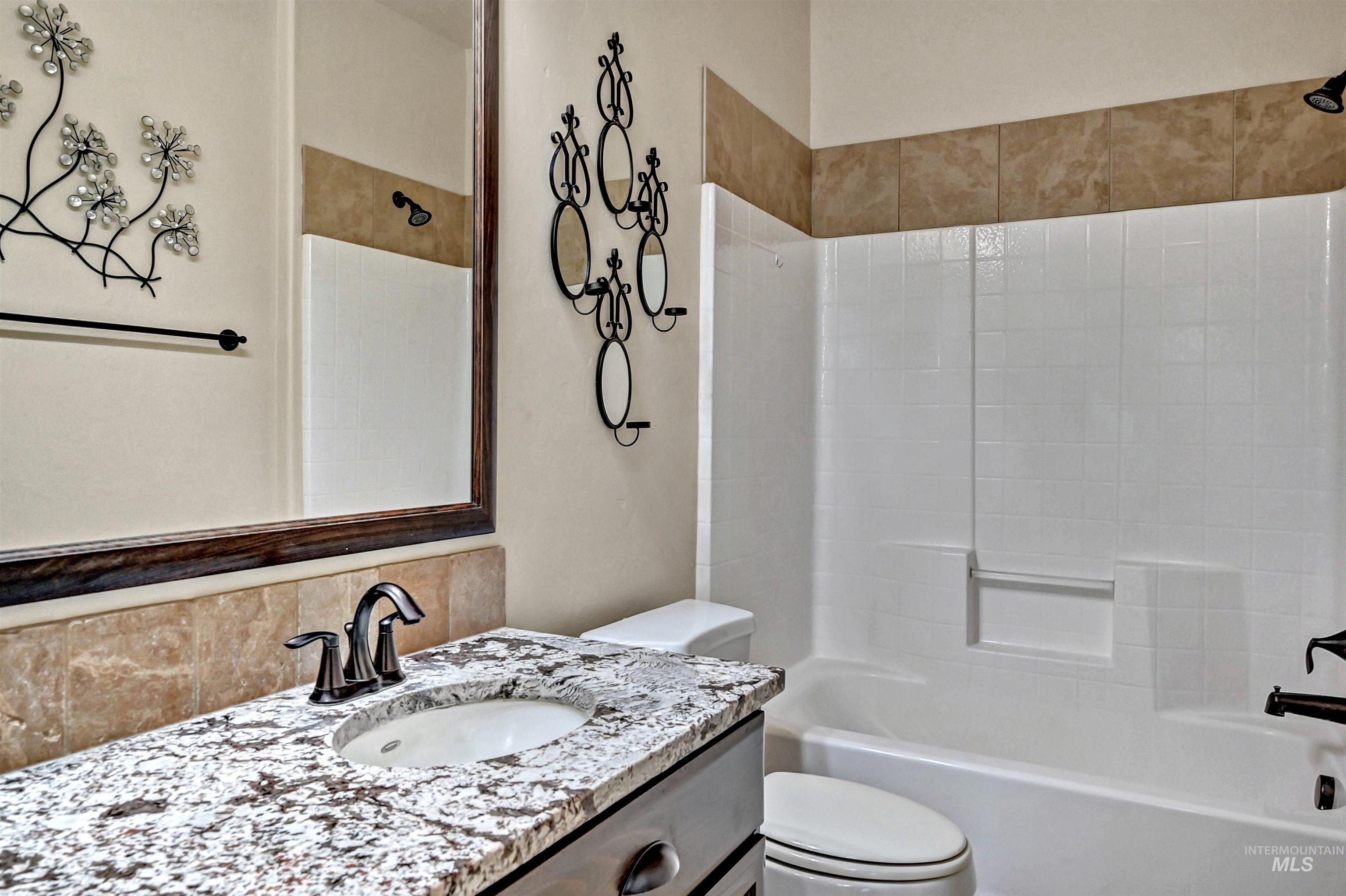 Full bath with vanity and  shower combination