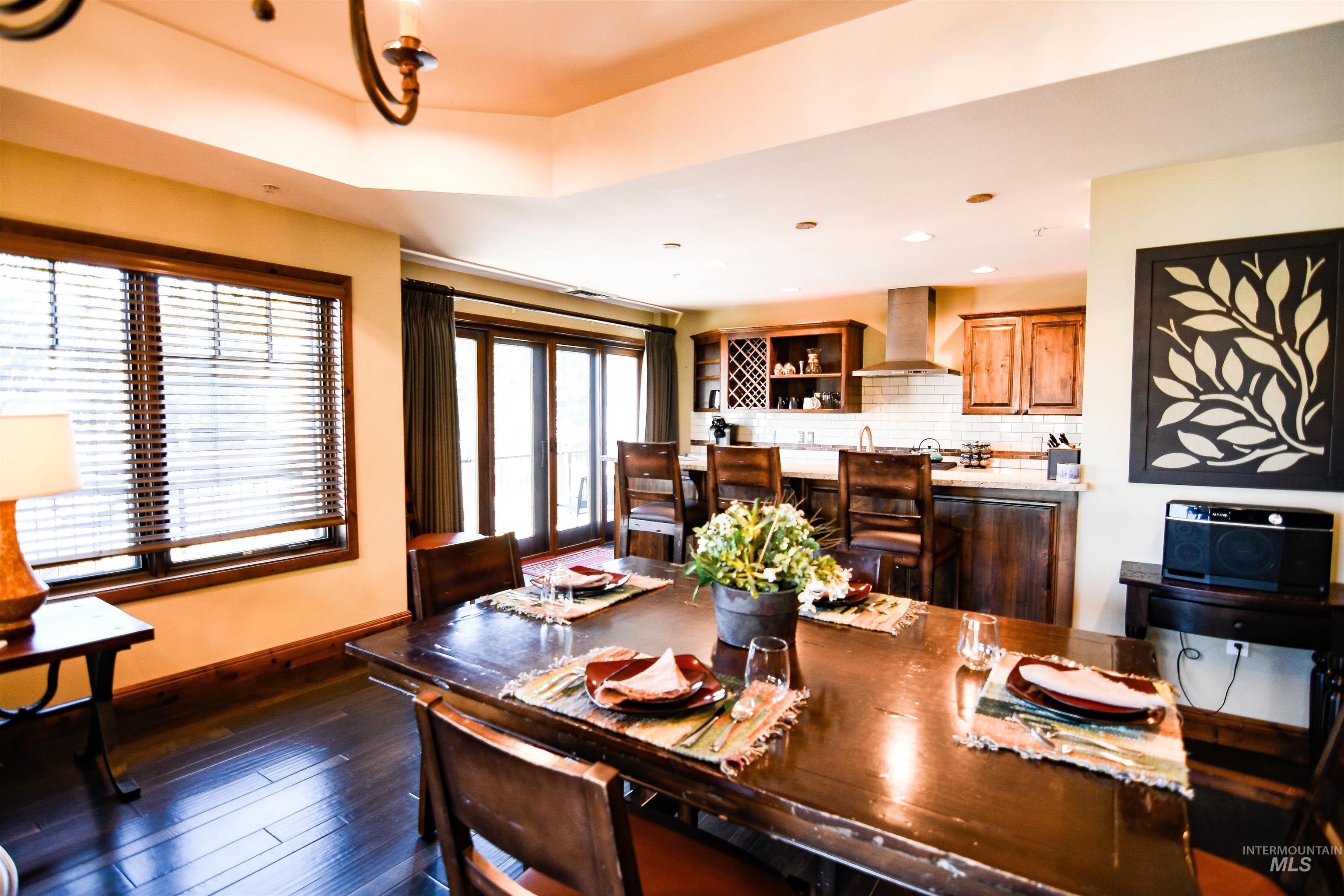 Dining room featuring dark wood-type flooring and recessed lighting