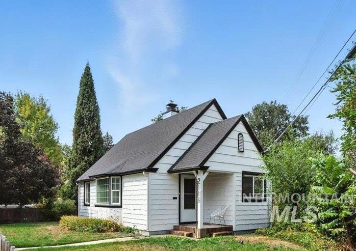 Bungalow-style home with roof with shingles