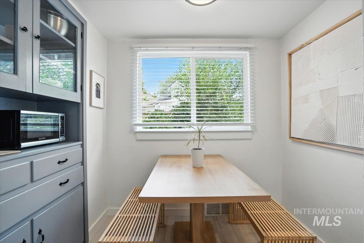 Dining area featuring baseboards and light wood-type flooring