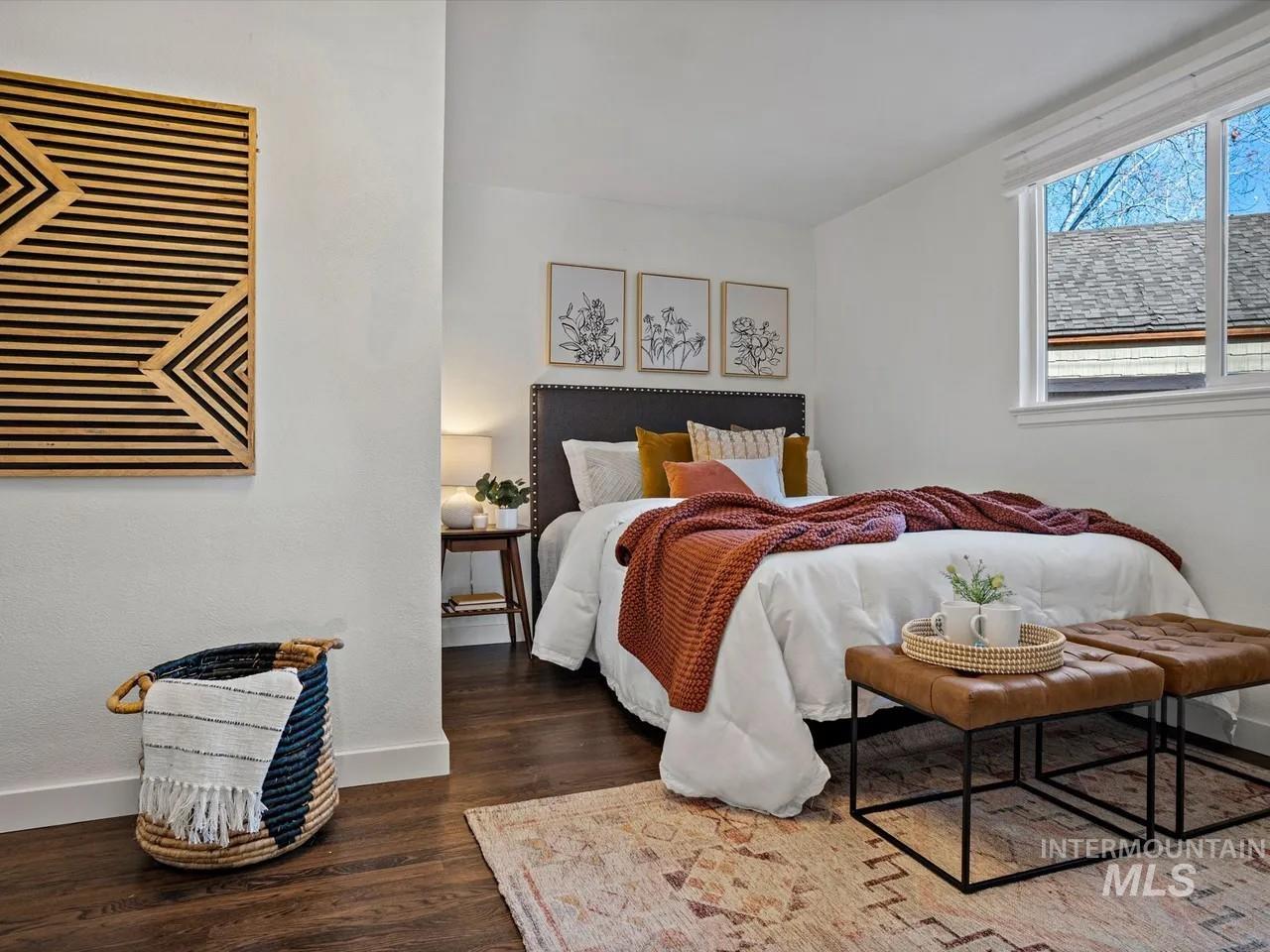 Bedroom with baseboards and dark wood-style floors
