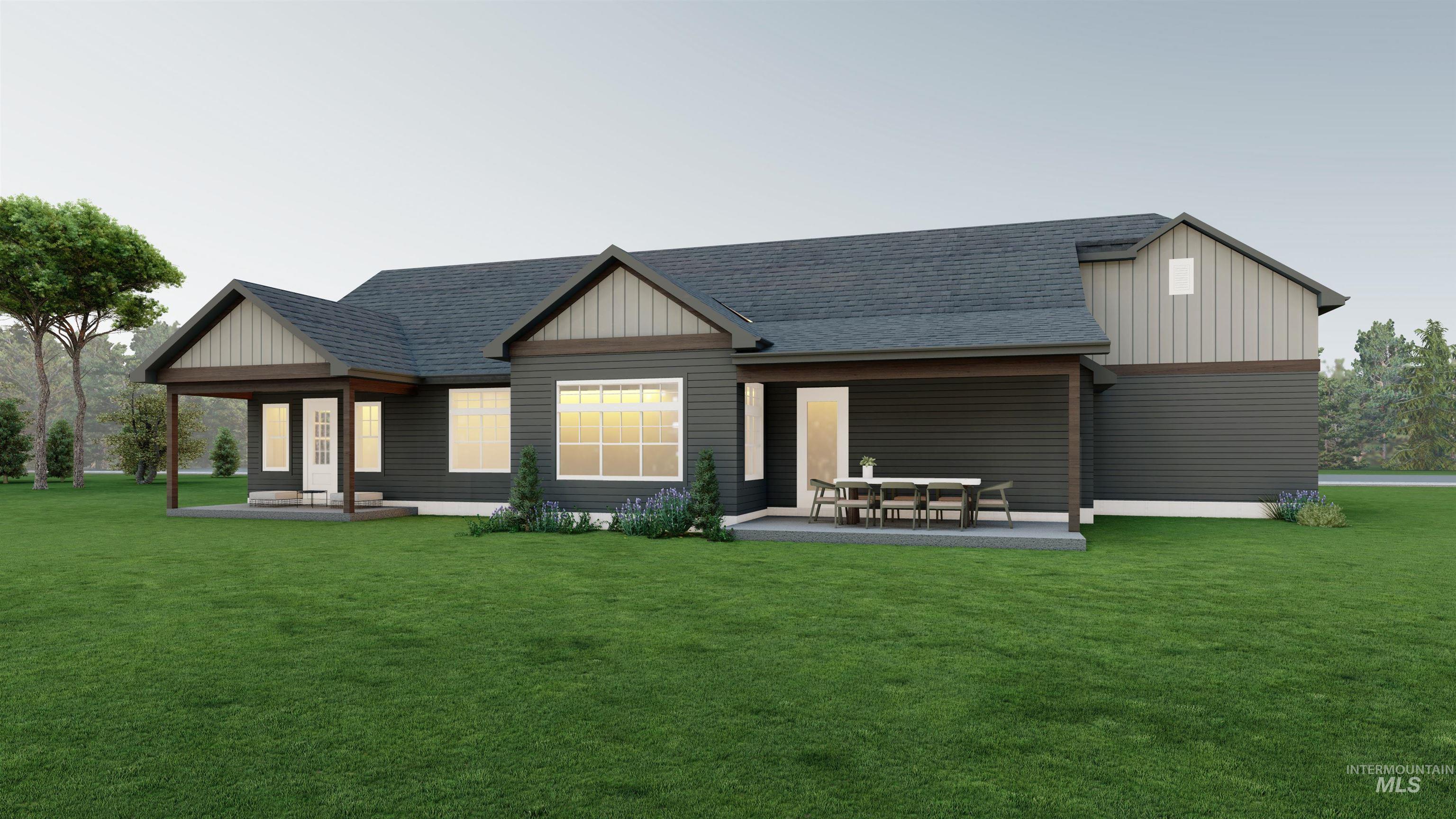 Rear view of house featuring a shingled roof, a lawn, covered porch, and board and batten siding