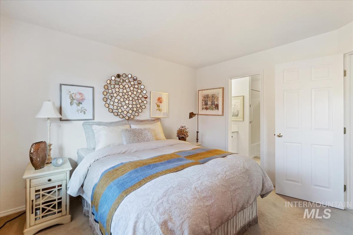 Carpeted bedroom with ensuite bath
