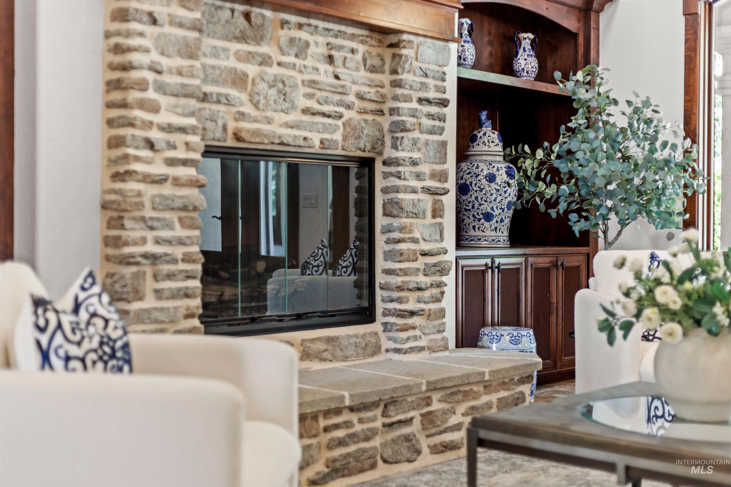 Stone-clad fireplace with a recessed firebox and stone hearth
