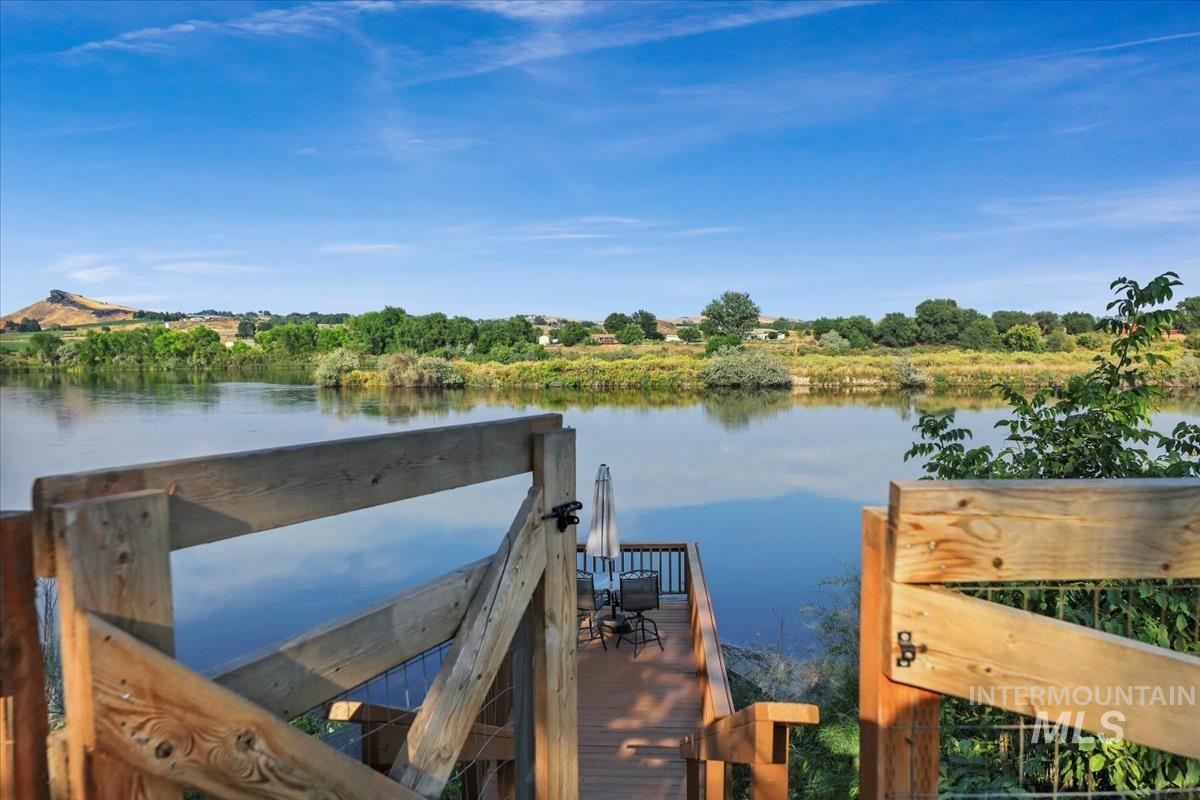 Dock area featuring a water view