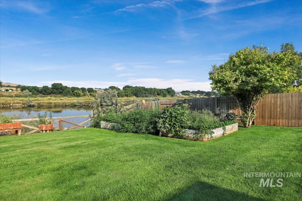 View of yard with a water view
