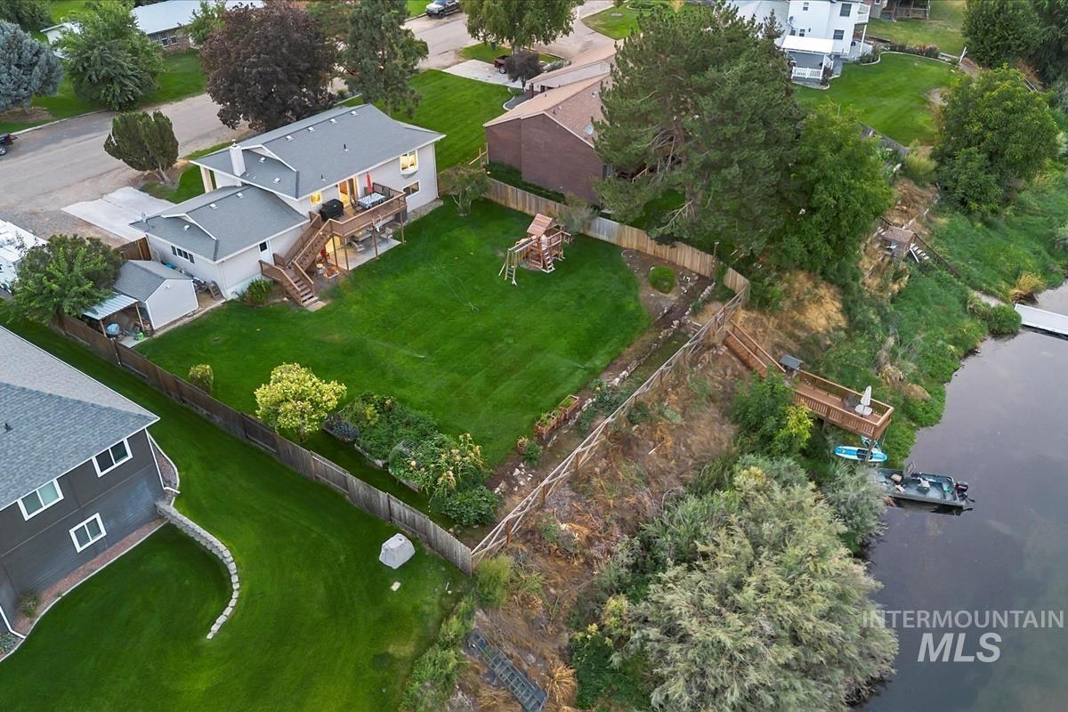 Aerial overview of property's location featuring nearby suburban area