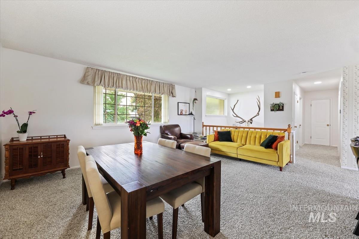 Dining area featuring carpet and baseboards