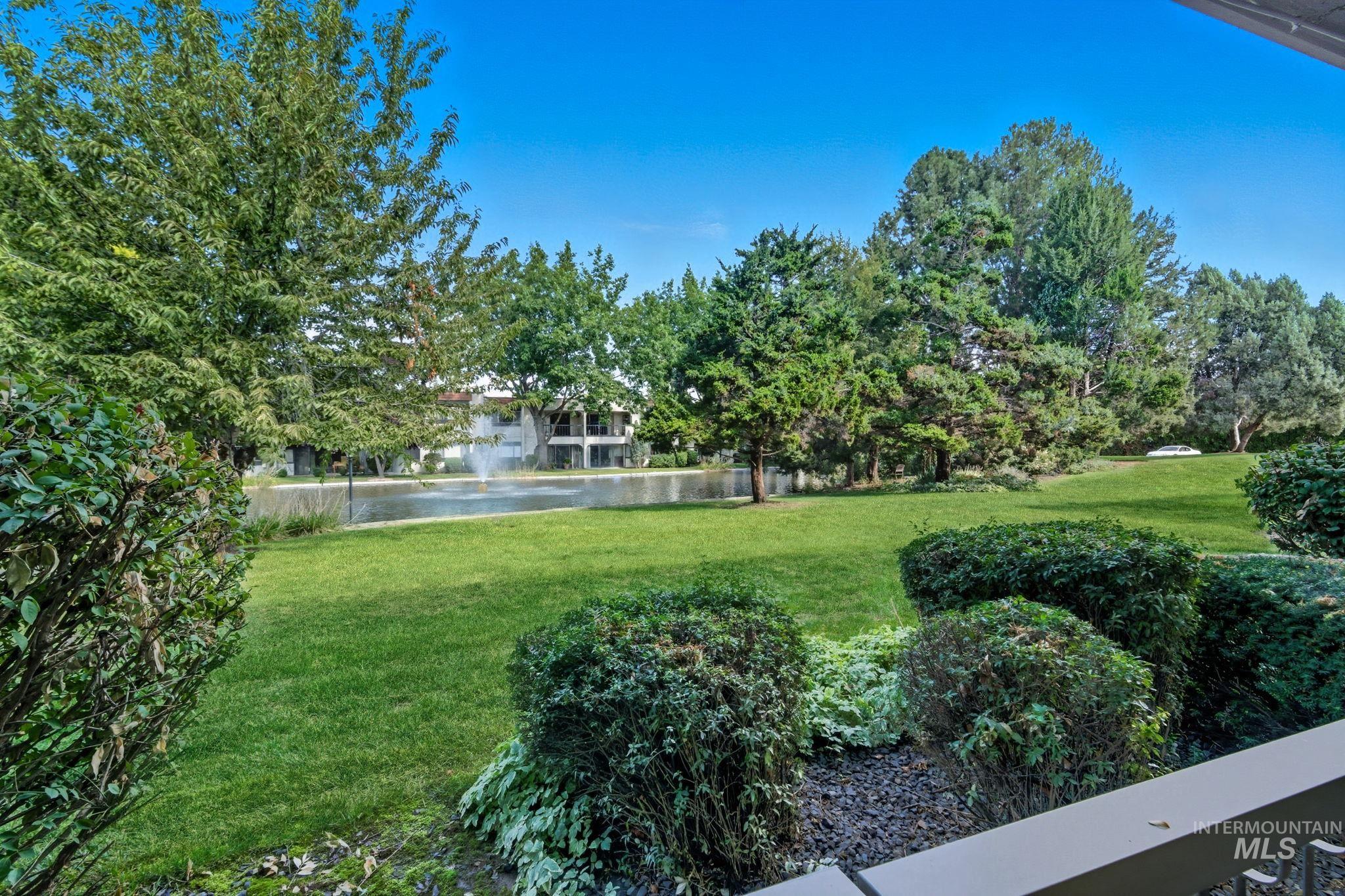 View of green lawn with a water view