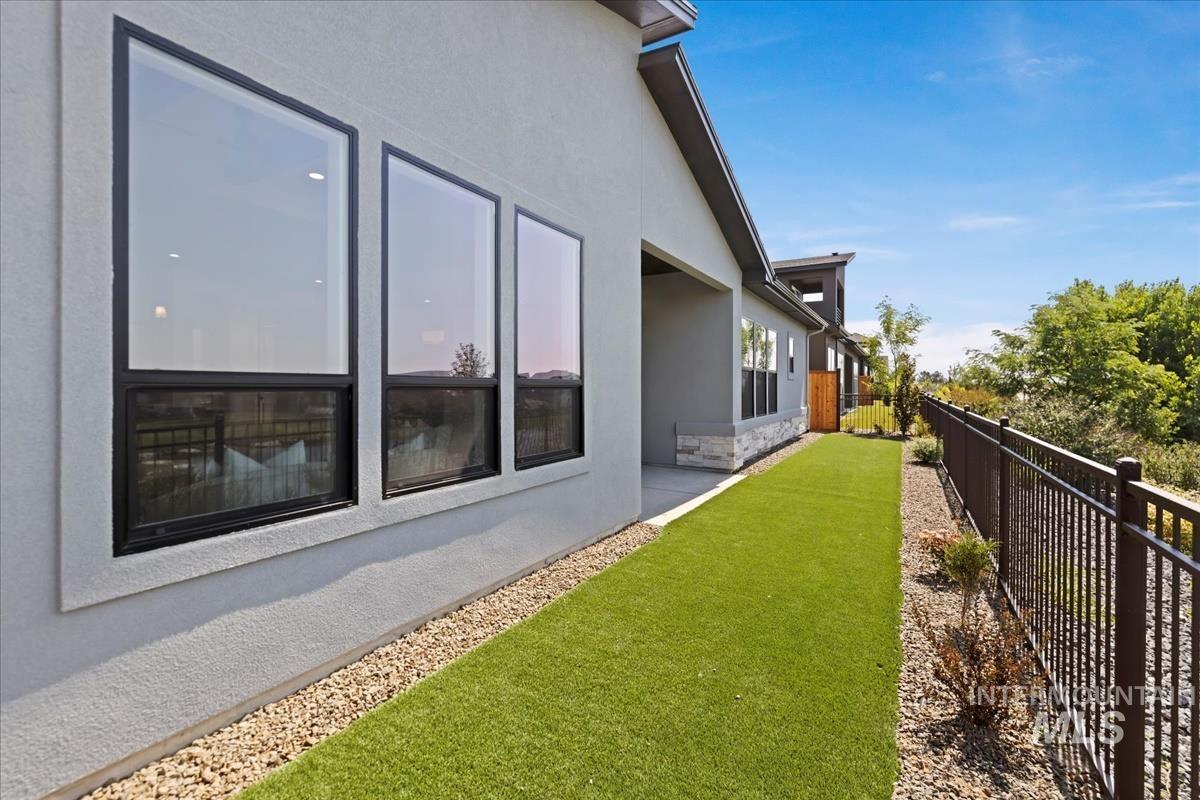 Fenced backyard with a patio