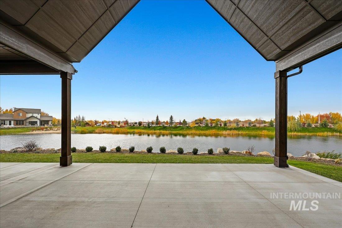 View of patio with a water view