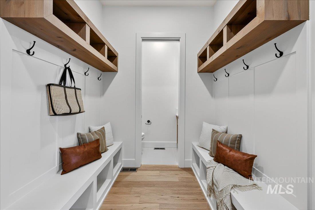 Mudroom featuring light wood finished floors
