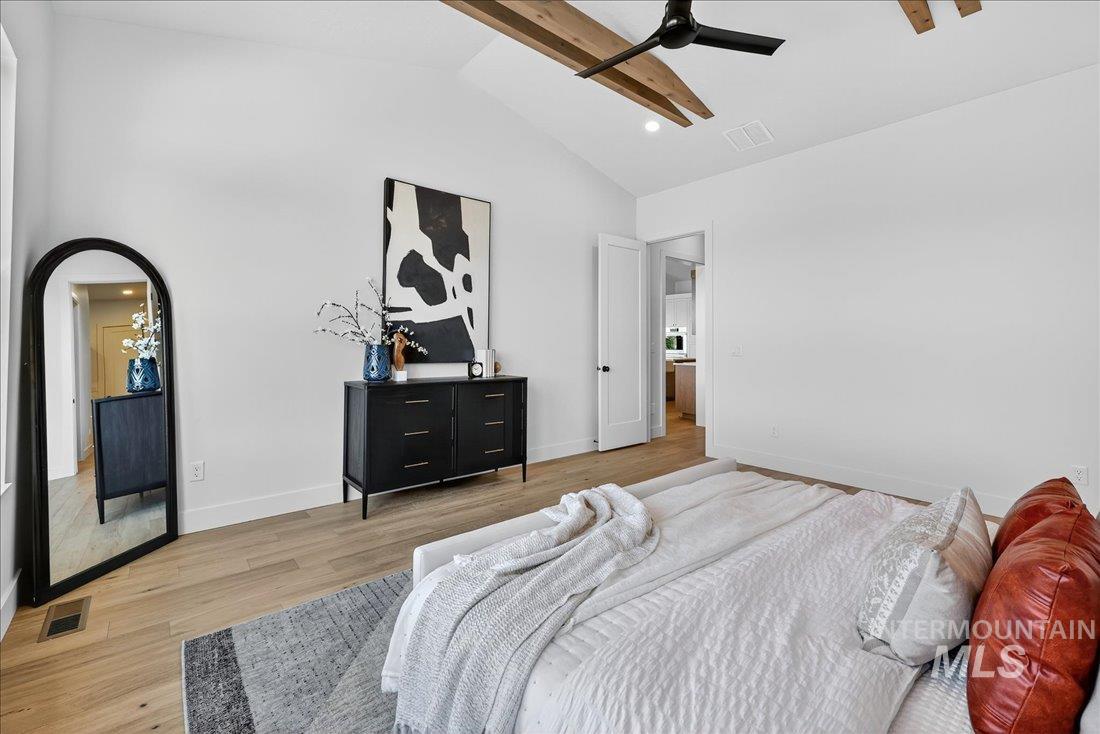 Bedroom featuring light wood-style floors, beam ceiling, high vaulted ceiling, recessed lighting, and ceiling fan