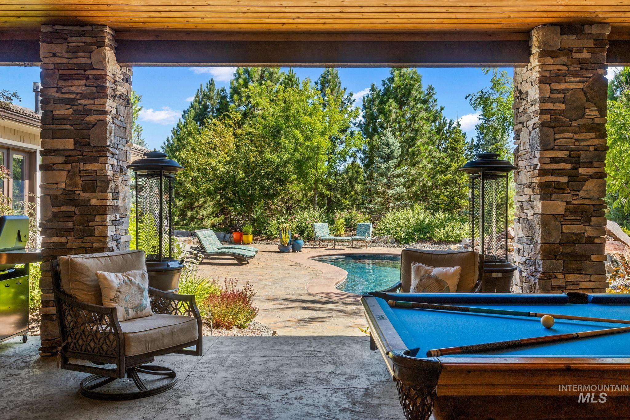 View of patio / terrace with an outdoor pool and grilling area