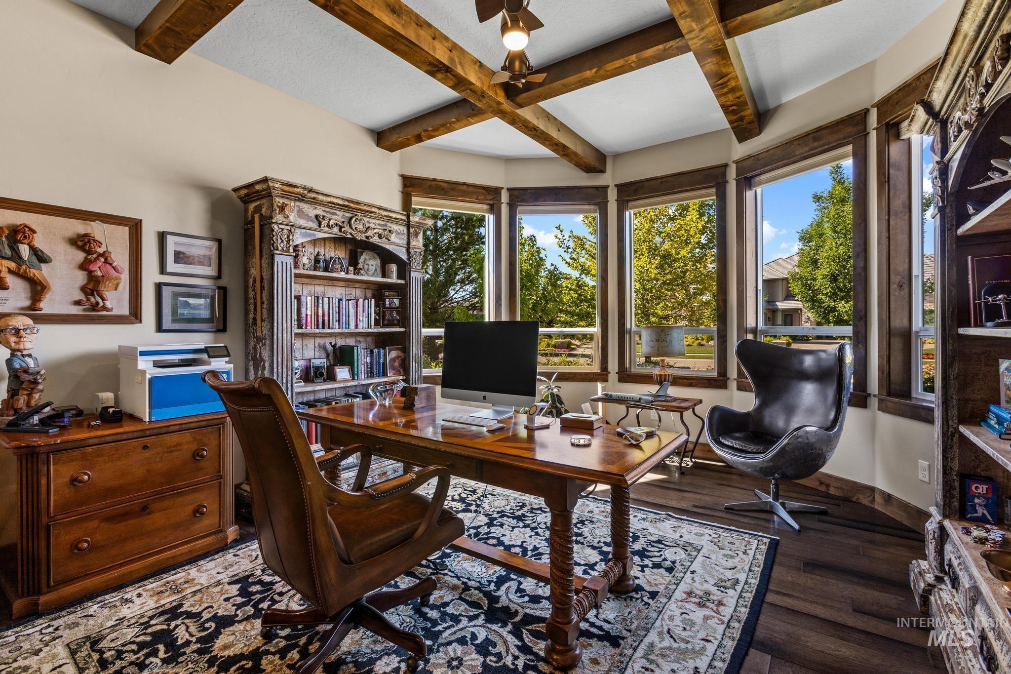 Office space with coffered ceiling, hardwood / wood-style floors, and beamed ceiling