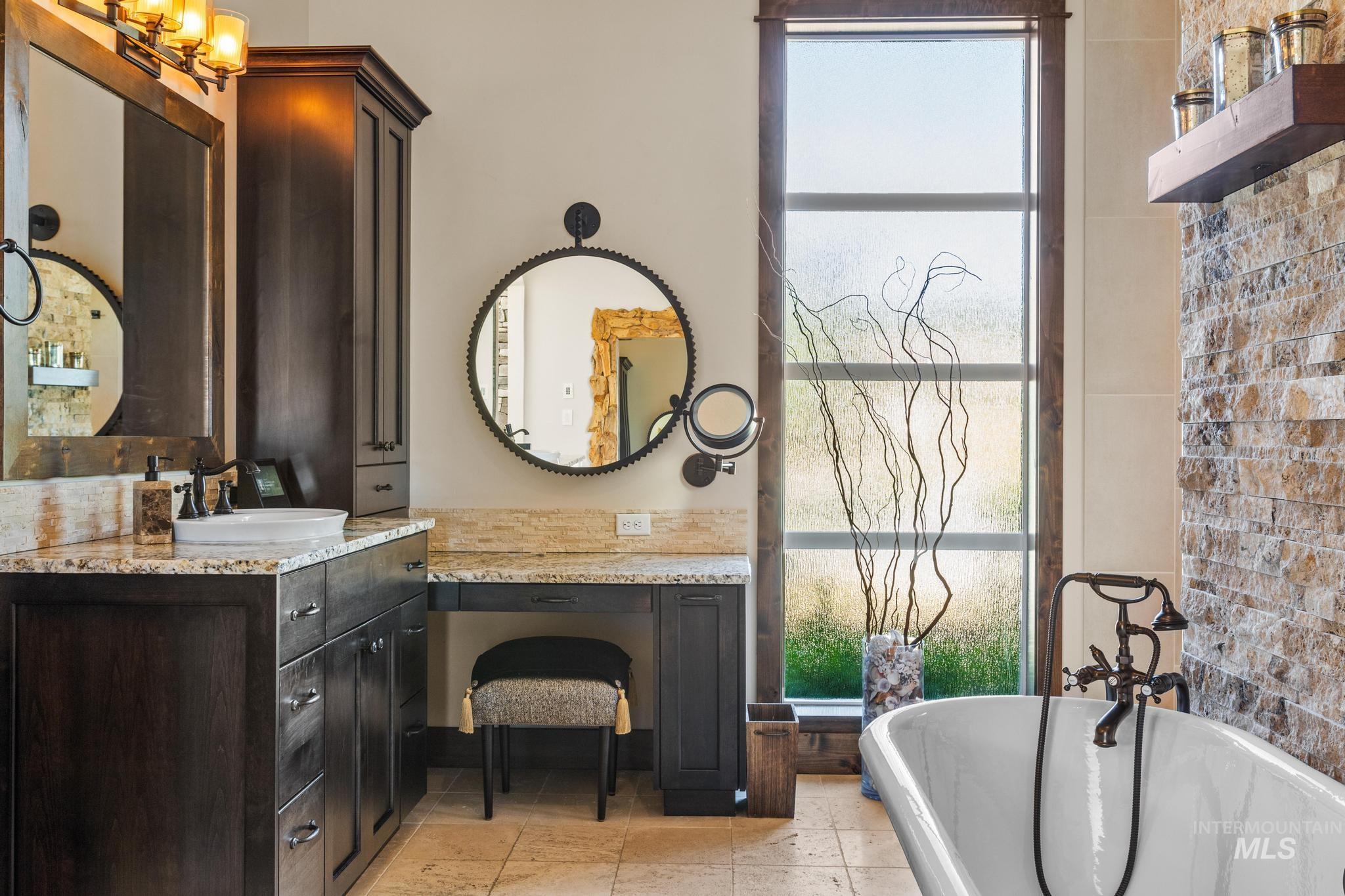 Full bathroom with a freestanding bath and vanity