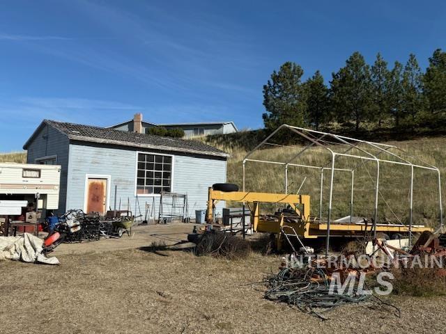 Rear view of property featuring a patio and a chimney